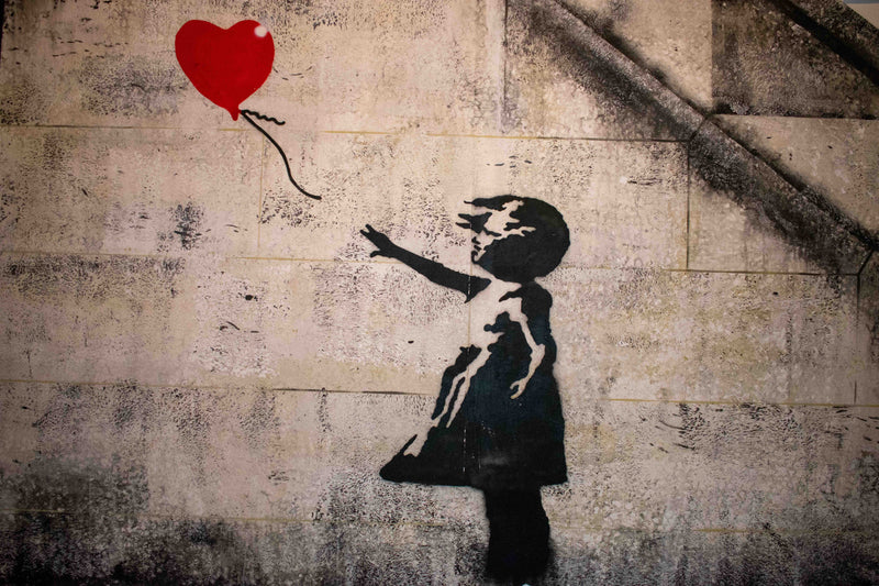 Banksy's Paris Murals Critique Society and Politics Through Street Art