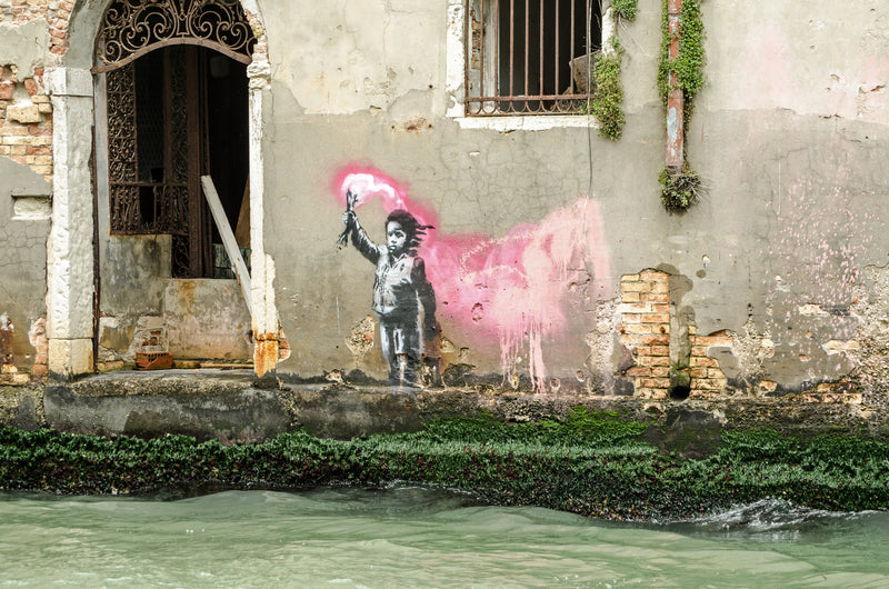 Banksy's Migrant Child Mural Restored and Returned to Venice Canals