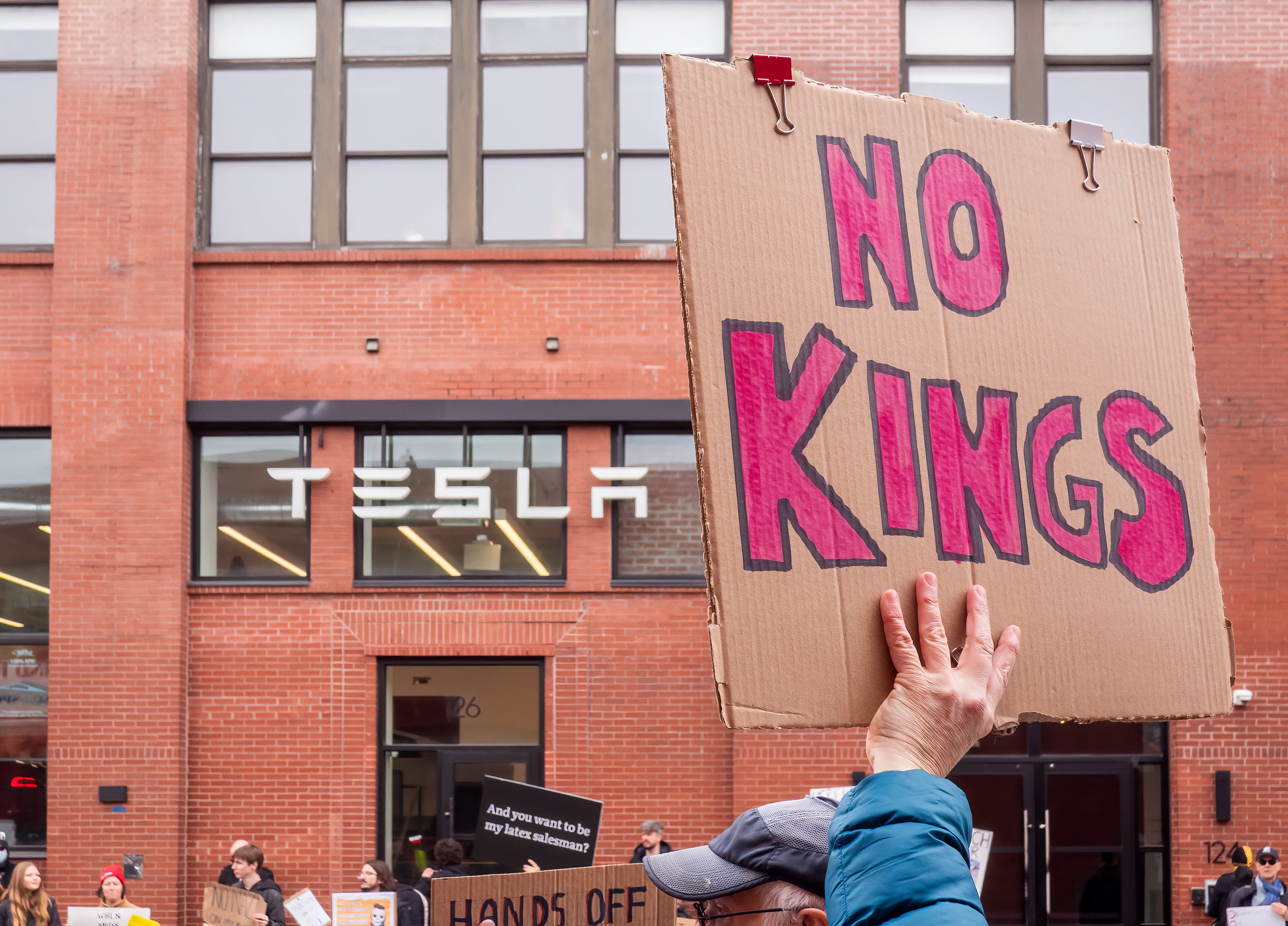 Tesla Takedown demonstration in Brooklyn New York with protesters outside a Tesla location