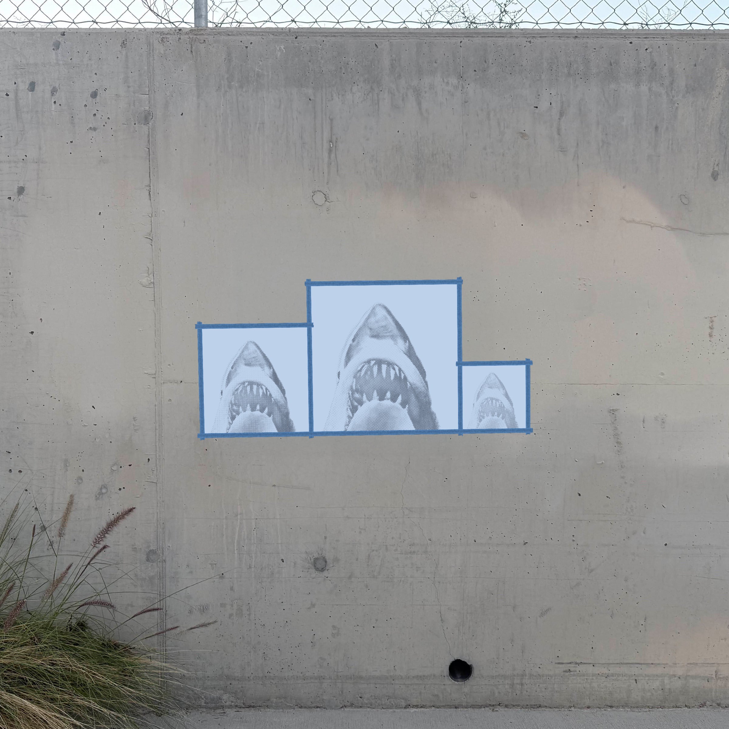 Jaws halftone stencil sprayed on a concrete wall