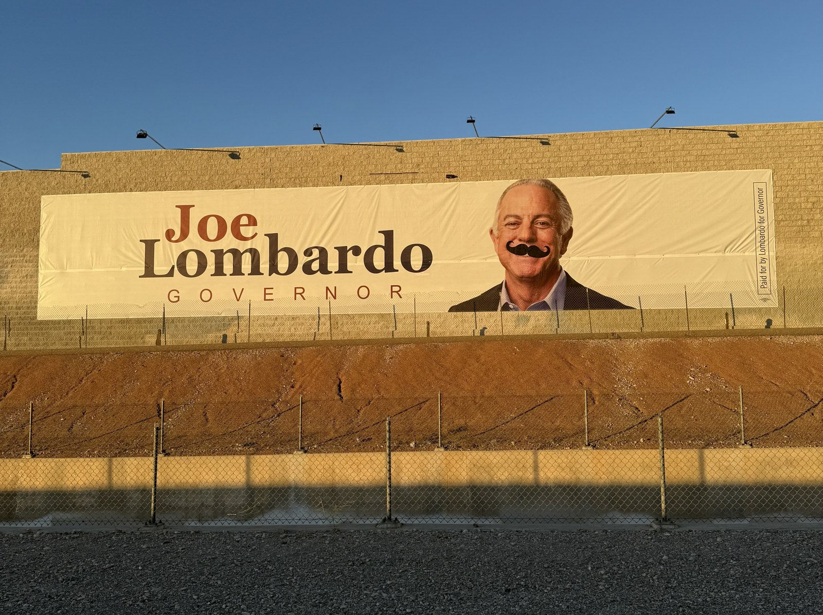 Governor Joe Lombardo campaign banner with a mustache added, Las Vegas