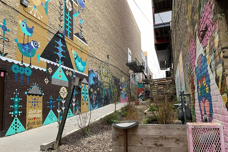 A San Francisco Street Artist Steals City Grates, Stencils a Cartoon Art Snob on Them, and Sells the Metal Back for Real Money