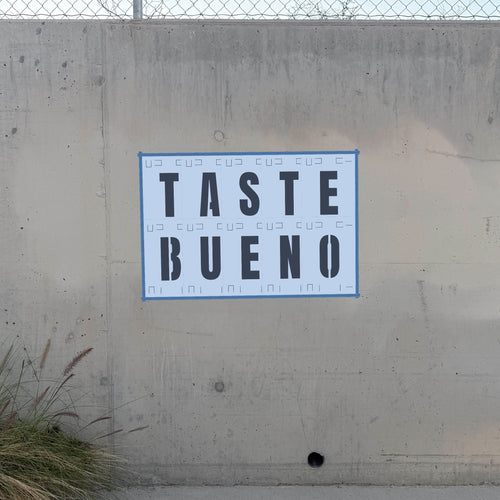 Anton Font Stencil Pack letter stencils latched together on a wall spelling TASTE BUENO